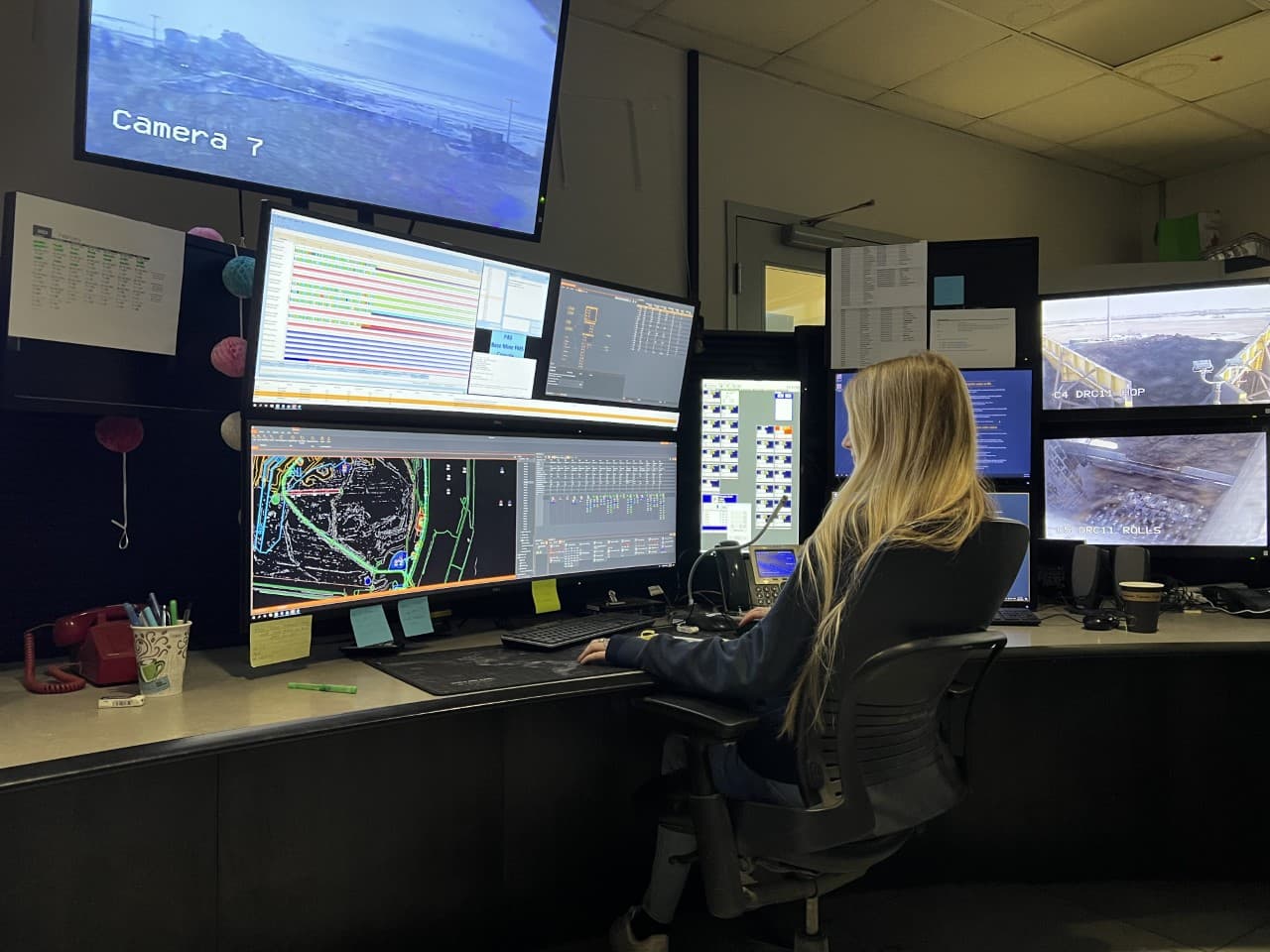 Kriste McCann works with a colleague at Mildred Lake Mine Dispatch.