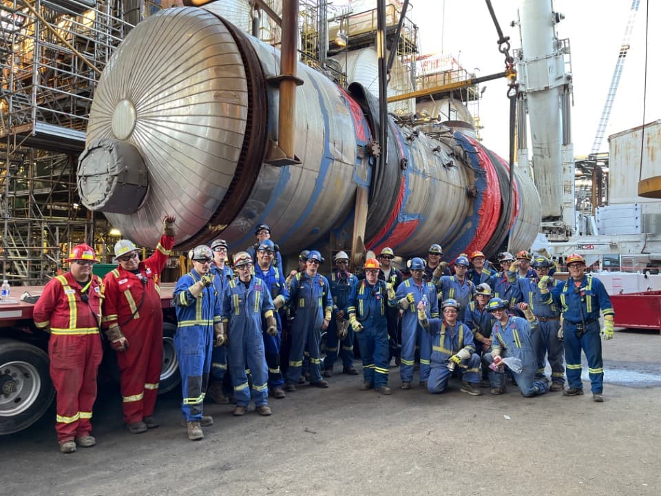 Suncor and Syncrude employees pose for a photo.