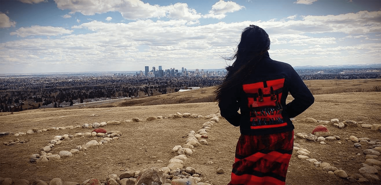 Debbie Green stands at the Blackfoot Medicine Wheel on Nose Hill in Calgary. Debbie advocates to bring awareness to Murdered and Missing Indigenous Women and Girls in memory of her sister who died when she was only 23.