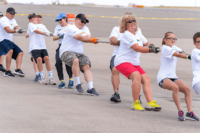 Suncor employees and family members “pulled for a purpose” this summer, hauling a 300-ton jumbo jet 12 feet in just under 11 seconds to raise money for Special Olympics Colorado.
