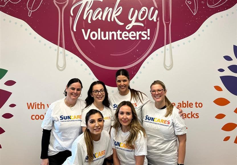 Suncor employees volunteering at the Calgary Drop-In Centre as part of the Suncor Energy Foundation volunteer program, SunCares.