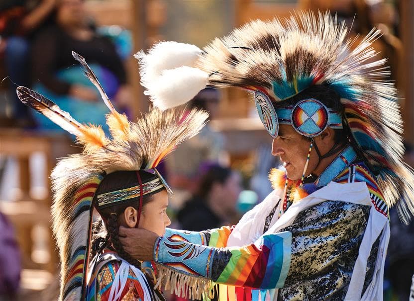 A moment between a father and son at the Fort McKay Pow Wow