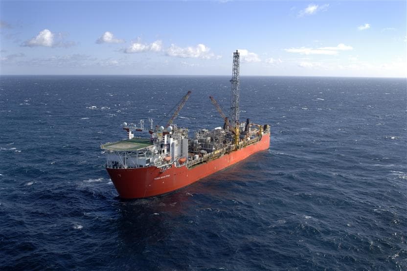 An orange floating production storage and offloading unit sits in the middle of the Atlantic Ocean near Newfoundland and Labrador.